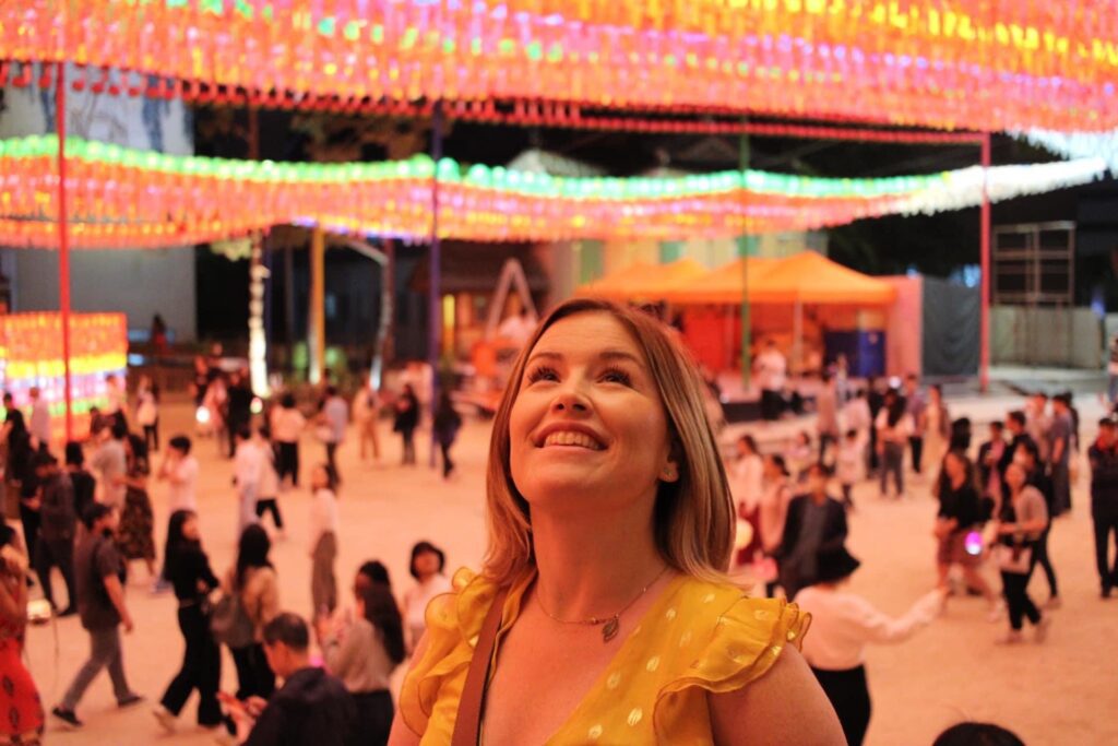 Author looking up at the bright lights of Jogyesa Temple