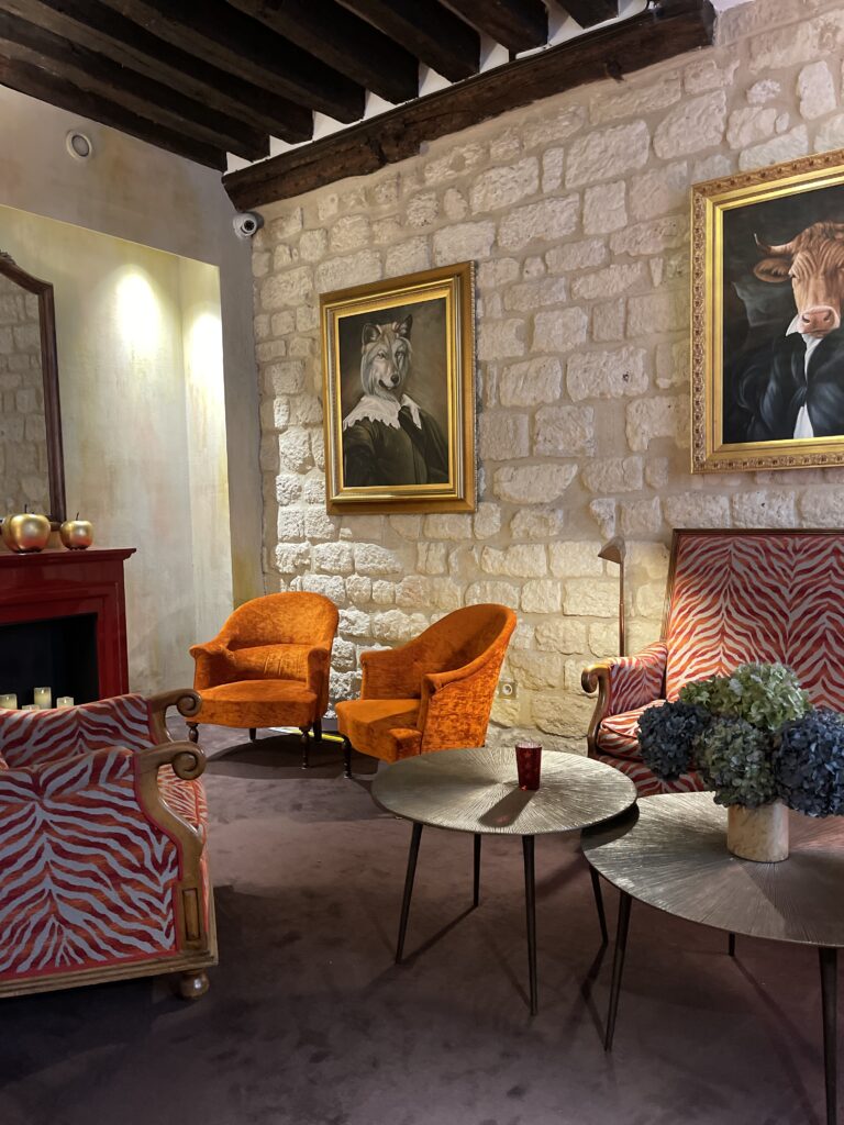 Eclectic Lobby of Hotel Saint Paul Rive Gauche feautring fun patterns and portraits of animals dressed in human attire