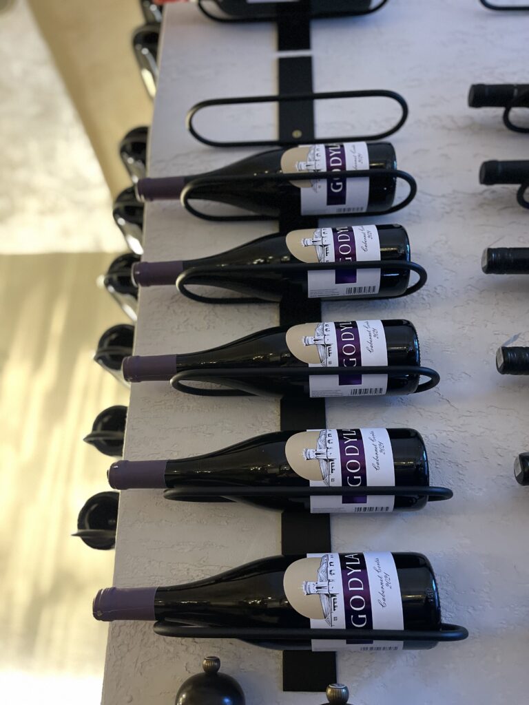 Wine rack hangin on wall in a restaurant in Krakow Poland