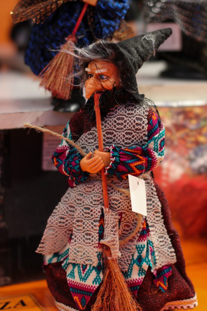 An image of a small Befana for purchase at an Italian Marketplace during the Epiphany. 