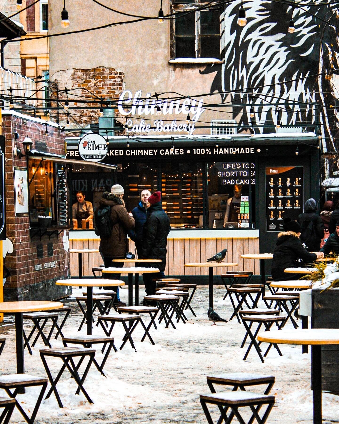 Judah Street Market in Kazimierz, Krakow Poland. Vibrant street art is displayed along with street food carts.