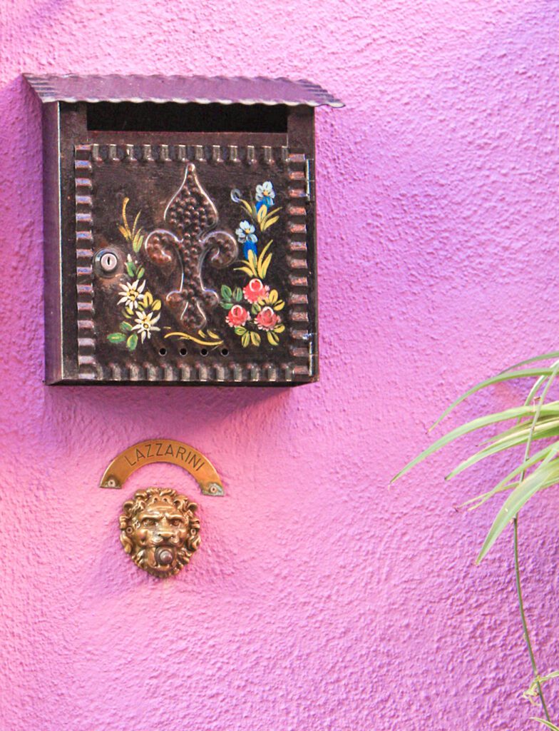 Post Box with decorative flowers on it in Burano Italy