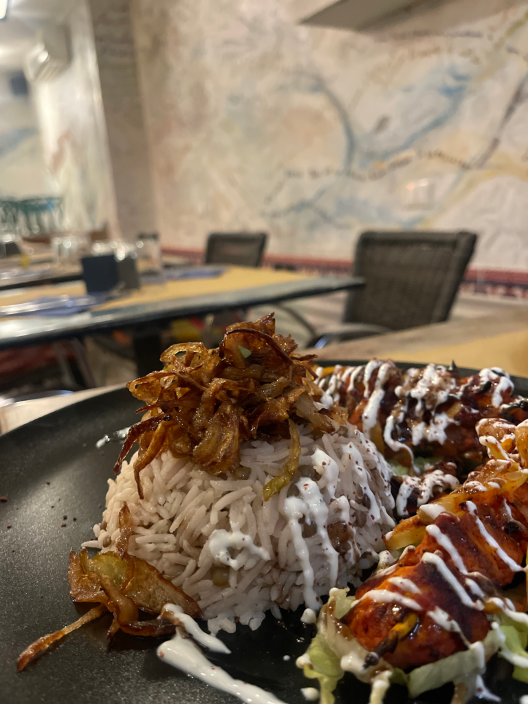 Middle Eastern food at Orient Express. Rice with beef and various dressings