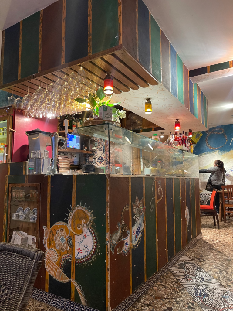 a colorful bar with different languages written on it at the Orient Experience in Venice
