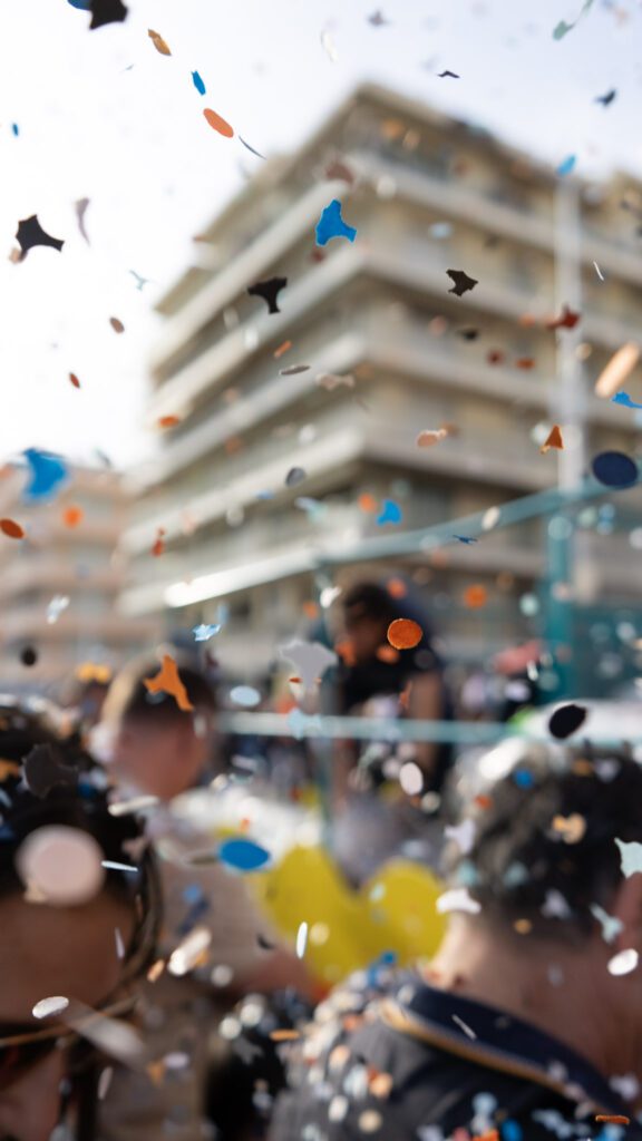 Close up of confetti raining down on spectators.