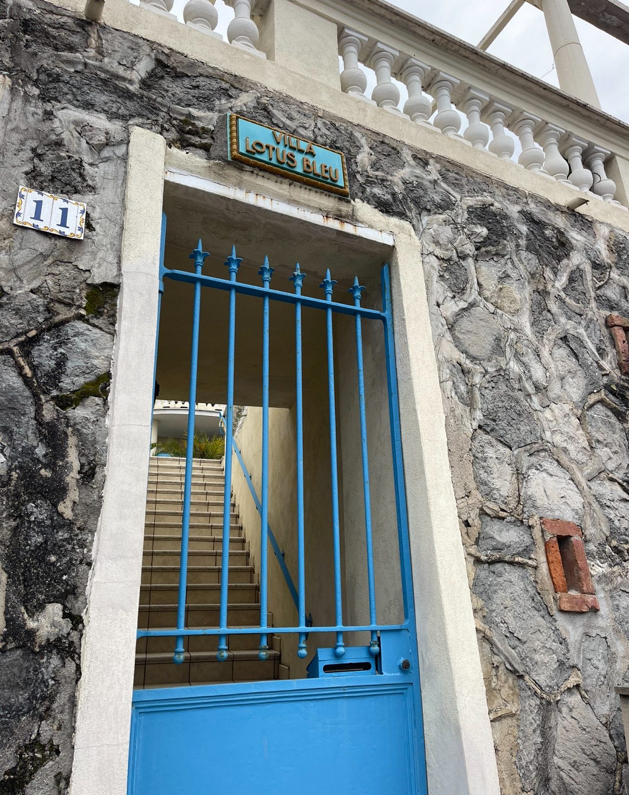 A Baby Blue Door leading to a stairwell in Garavan, Menton