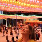 Woman looking up at lanterns at a temple in Seoul