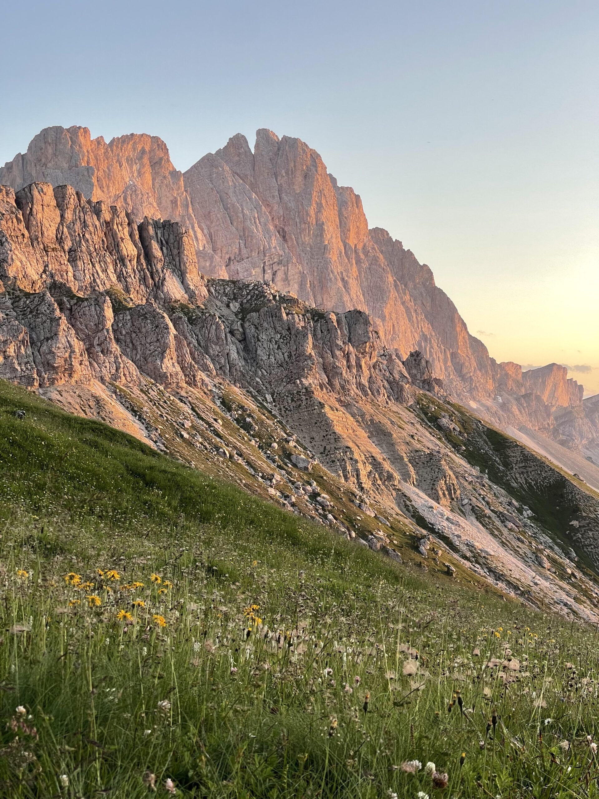 Peaks of the Dolomites in a golden hue with a beautiful sunset