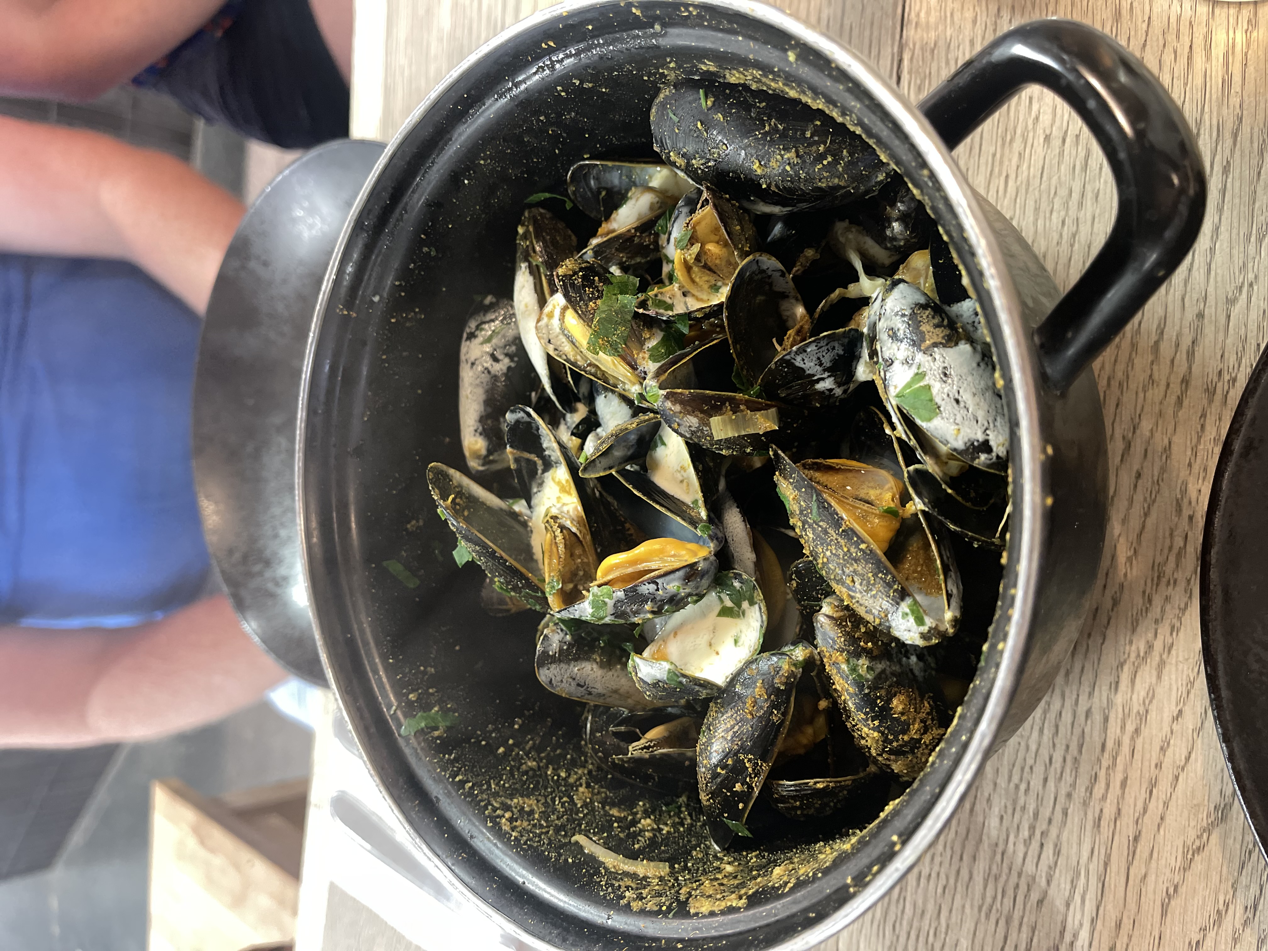 A bowl of mussels seasoned with curry from bistro poulette in Bordeaux