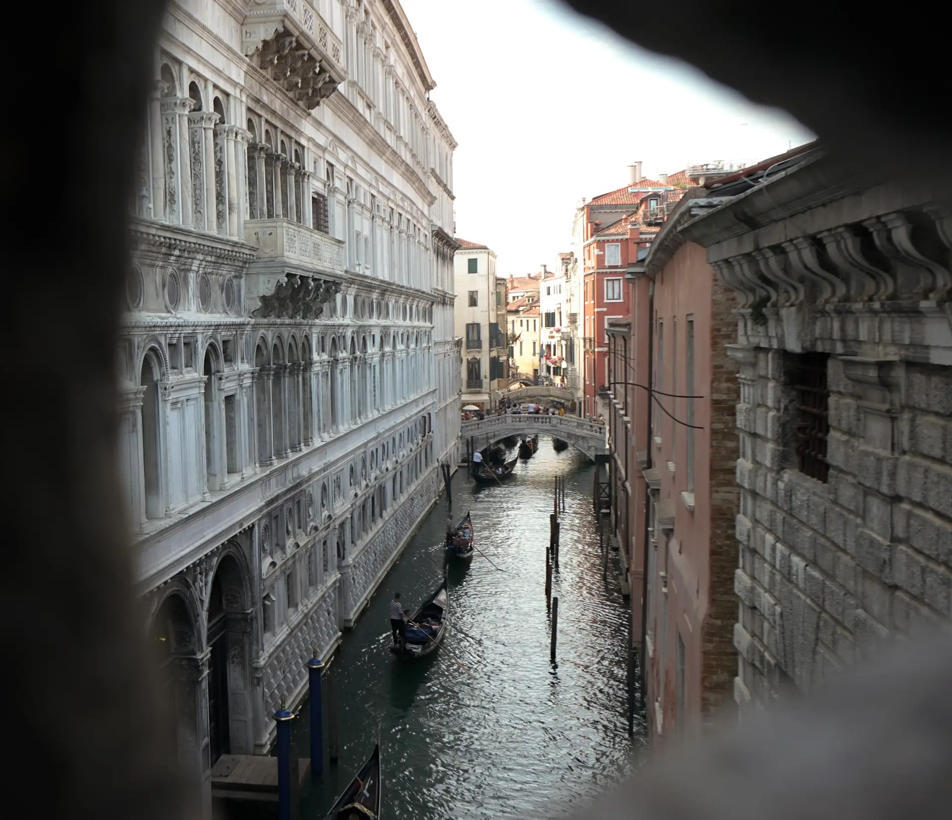 a view from the bridge of sighs in venice showcasing the canal below