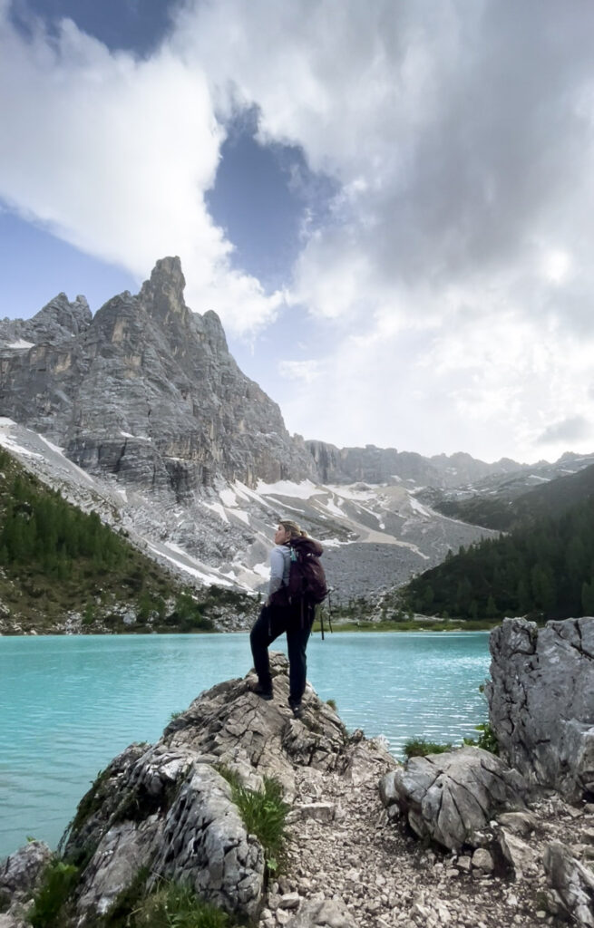 Author standing on rock looking out over Lago Di Sorapis