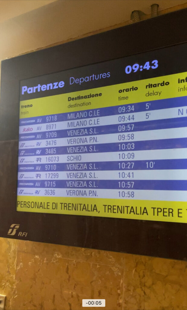 Yellow and Blue departures and arrival board you commonly find in a train station.