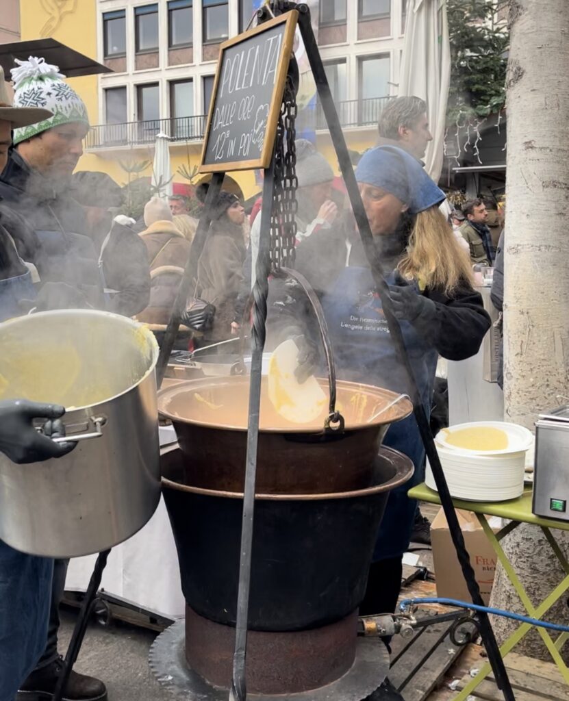 Polenta in a large cast iron pot in Bolzano Christmas Market