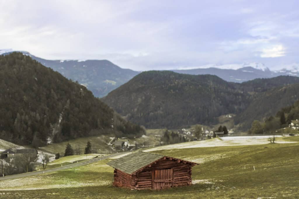 A Beautiful Meadow with an Alpine outhouse in the Dolomites in Italy