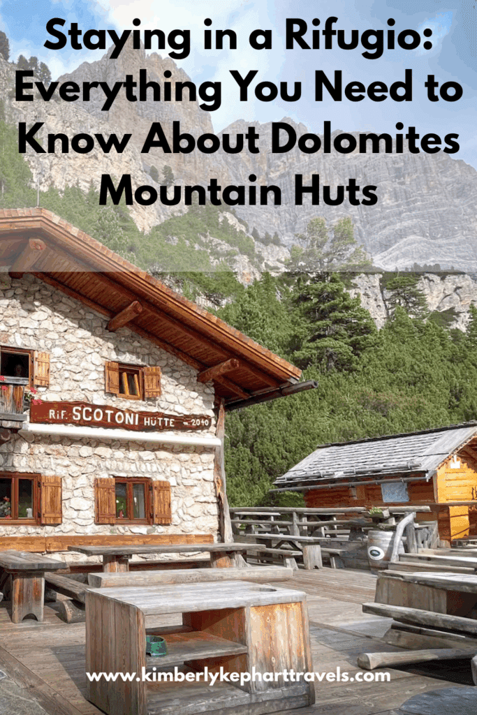 Pinterest Pin that has a mountain hut with tables in the background