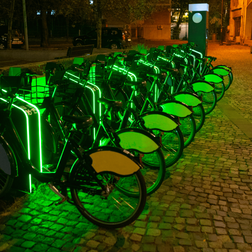 E-bikes sitting in a row on a city corner. A Sustainable way to travel. 