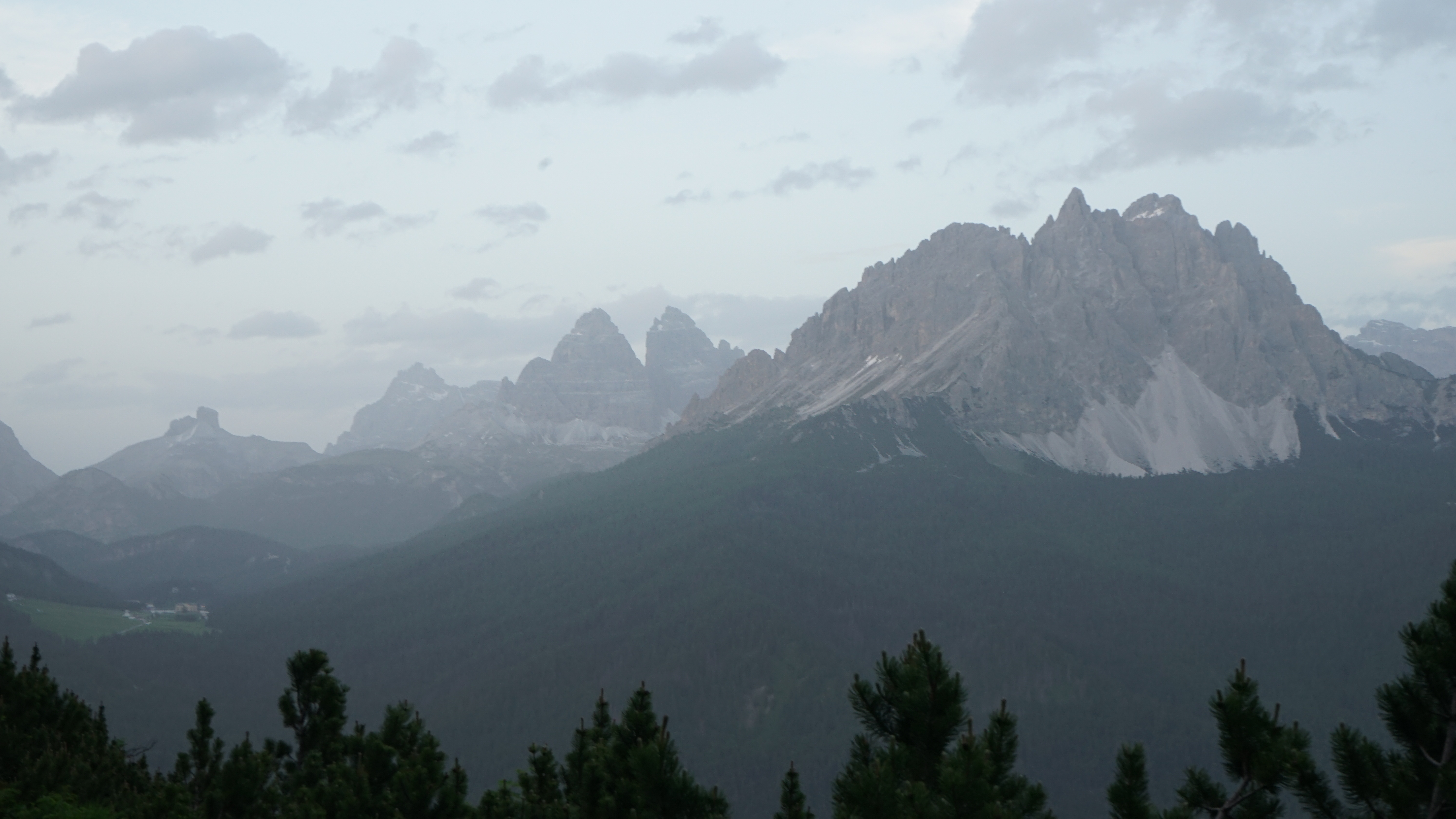 Peaks of the Dolomites stand out against a sunset