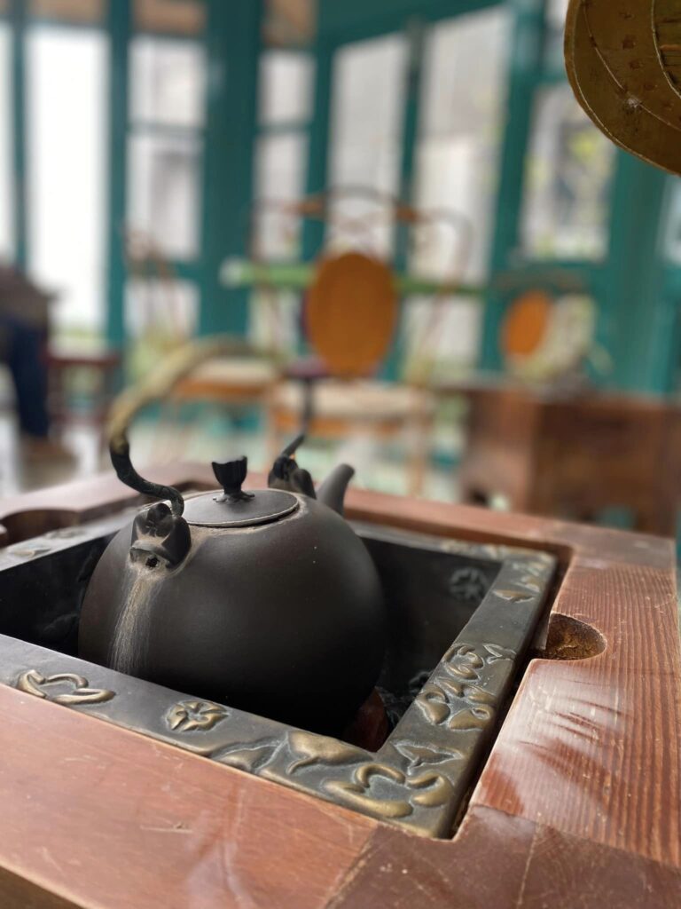 Teakettle sitting on Coals at a teahouse in Taiwan