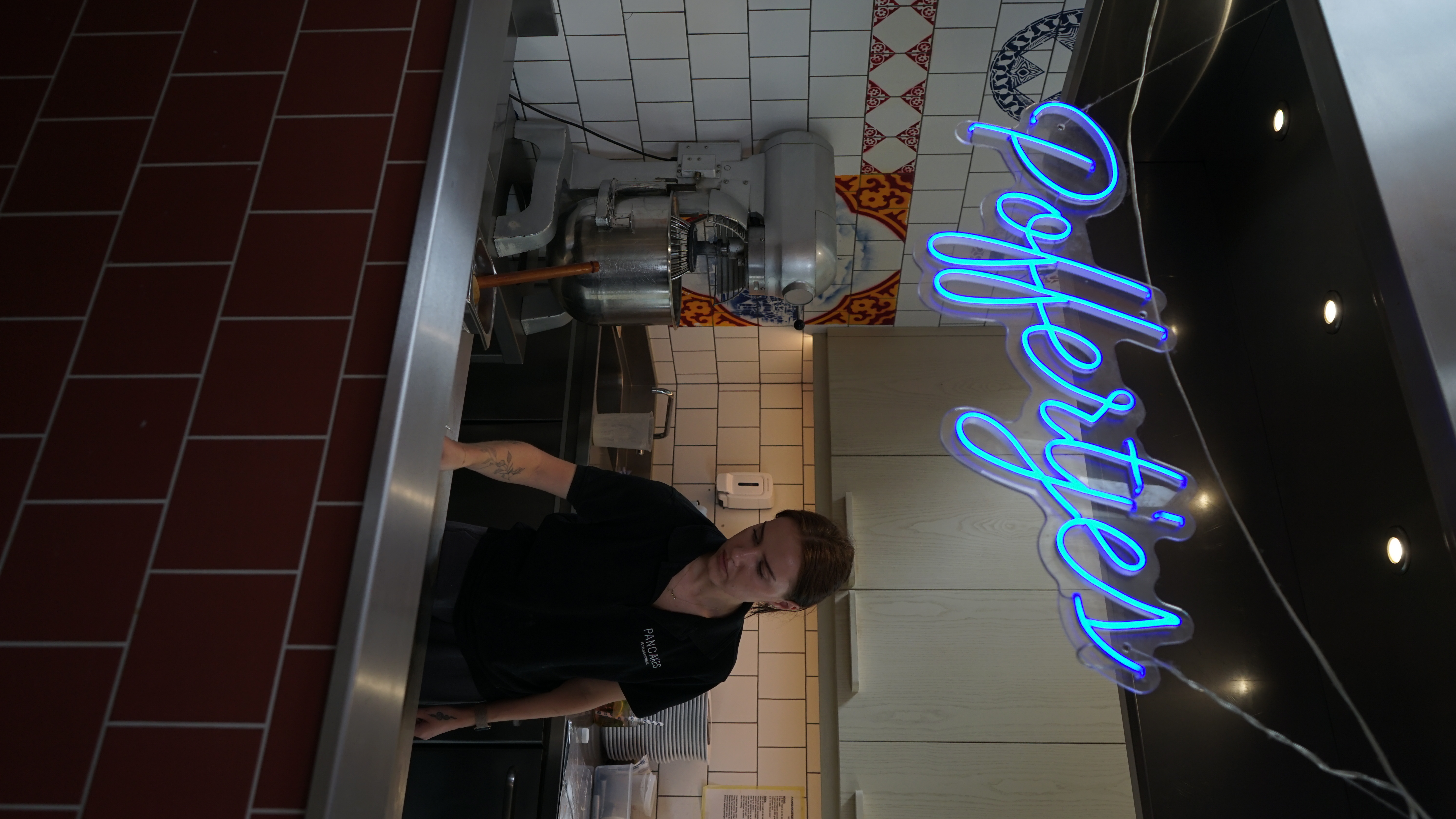 a person flipping poffjertjes in arestaurant in Amsterdam