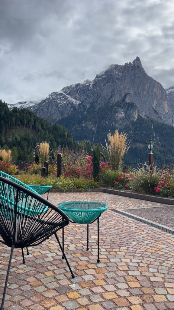 Blue lounge chair overlooking mountain in the Dolomites at Hotel Ortler