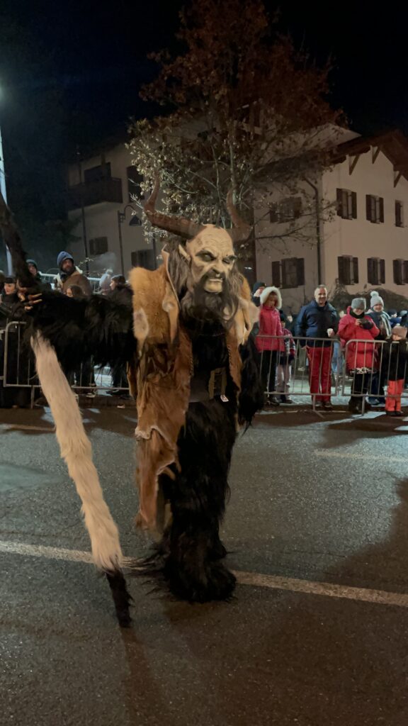 Krampus scaring people at a krampus run in castelruth