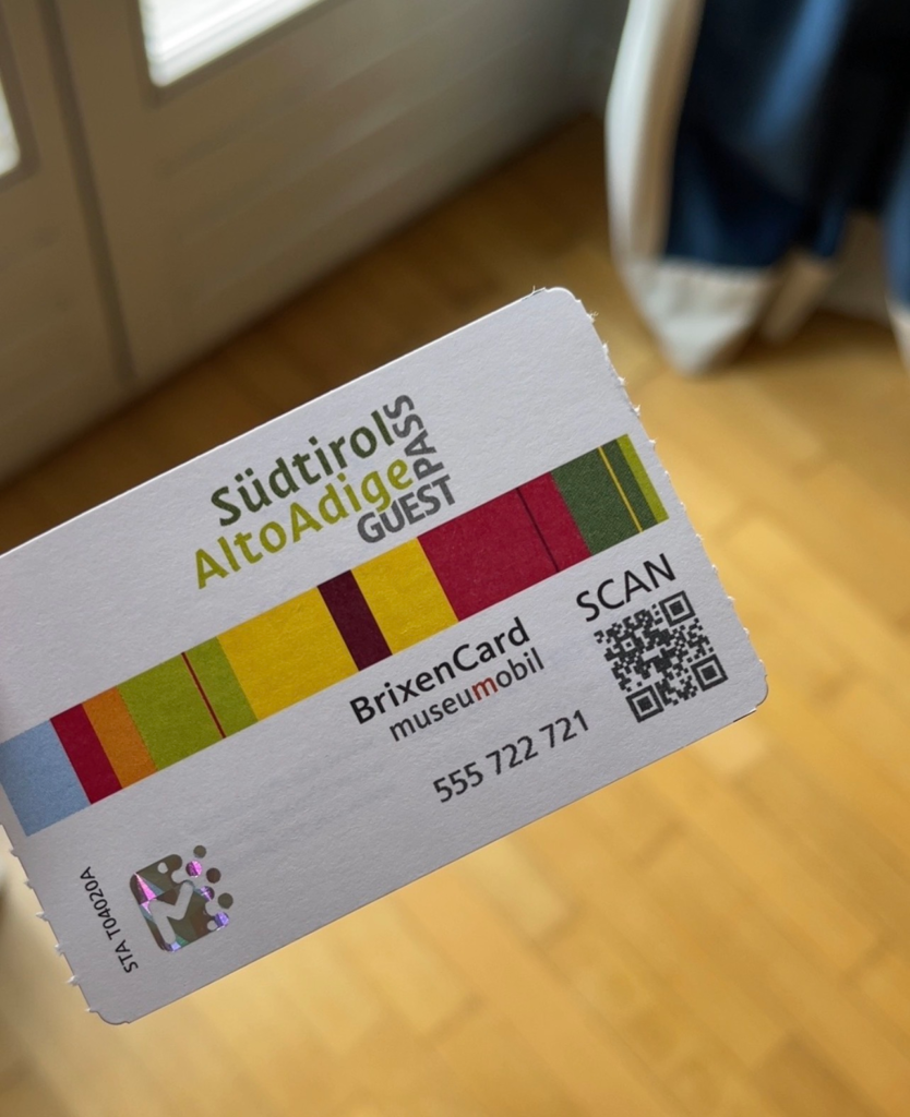 Südtirol Alto Adige Guest Pass BrixenCard museumobil with colorful stripes, QR code, and printed number 555 722 721. The card represents the complimentary regional transport and museum access included with a stay at Hotel Elephant in Brixen.