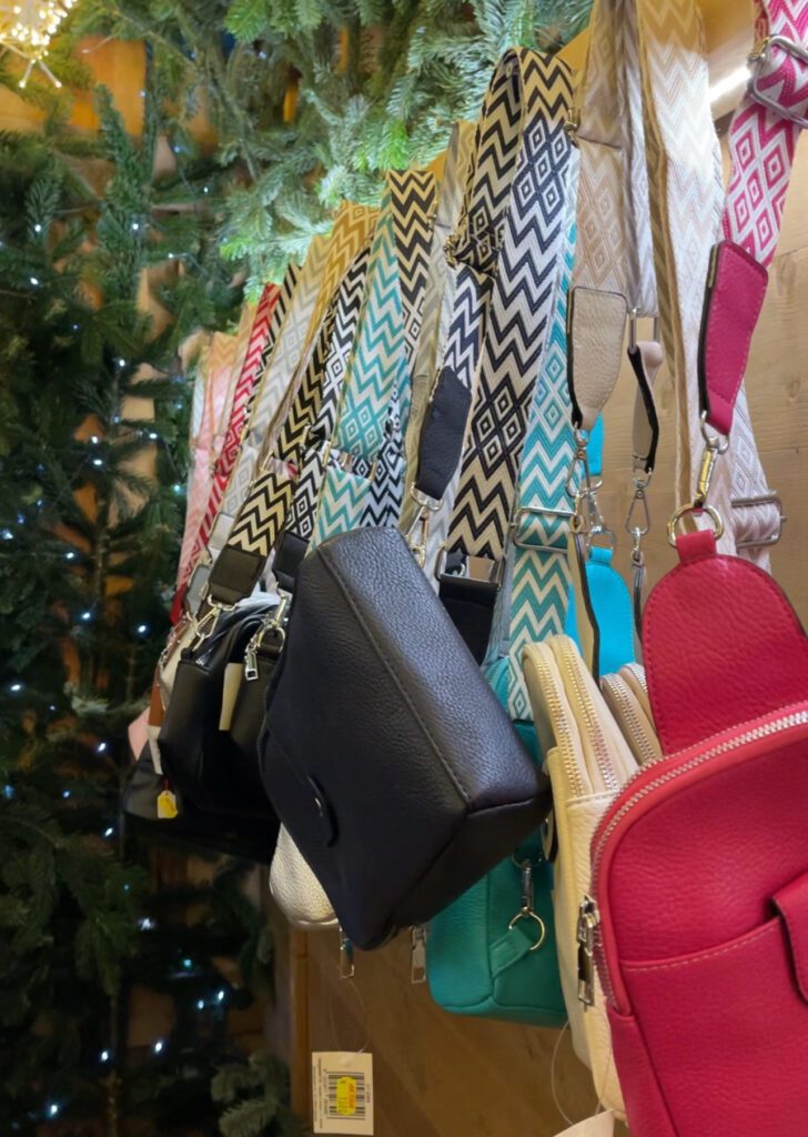 Bags for sale hanging on a stall at the ravenna Gorge Christmas market