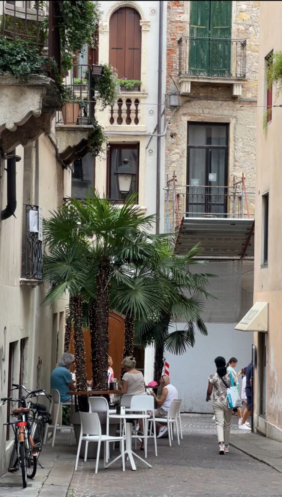 Via Pigafetta in Vicenza Italy with chairs from Cafe Pigafetta lining the walkway 