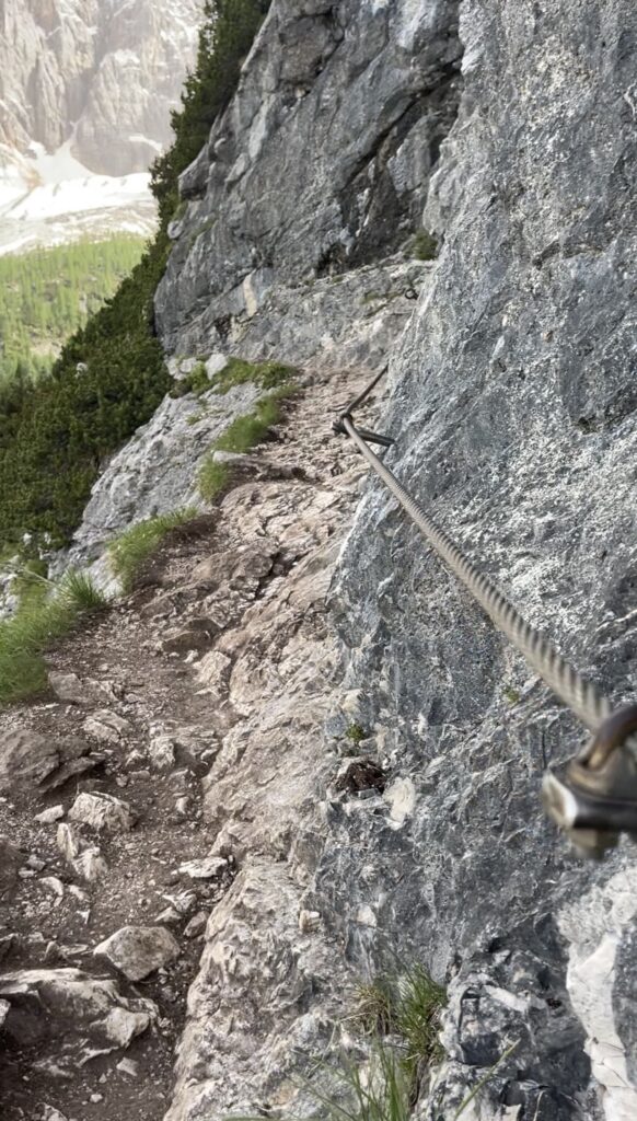 cables leading to the lago di sorapis and steep ledges of the trail