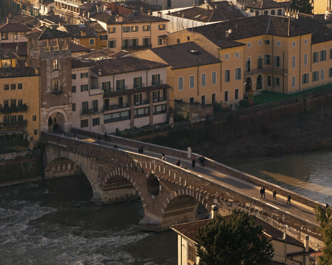 A view of Ponte Pietra in Verona Italy with the Adige River flowing under it.