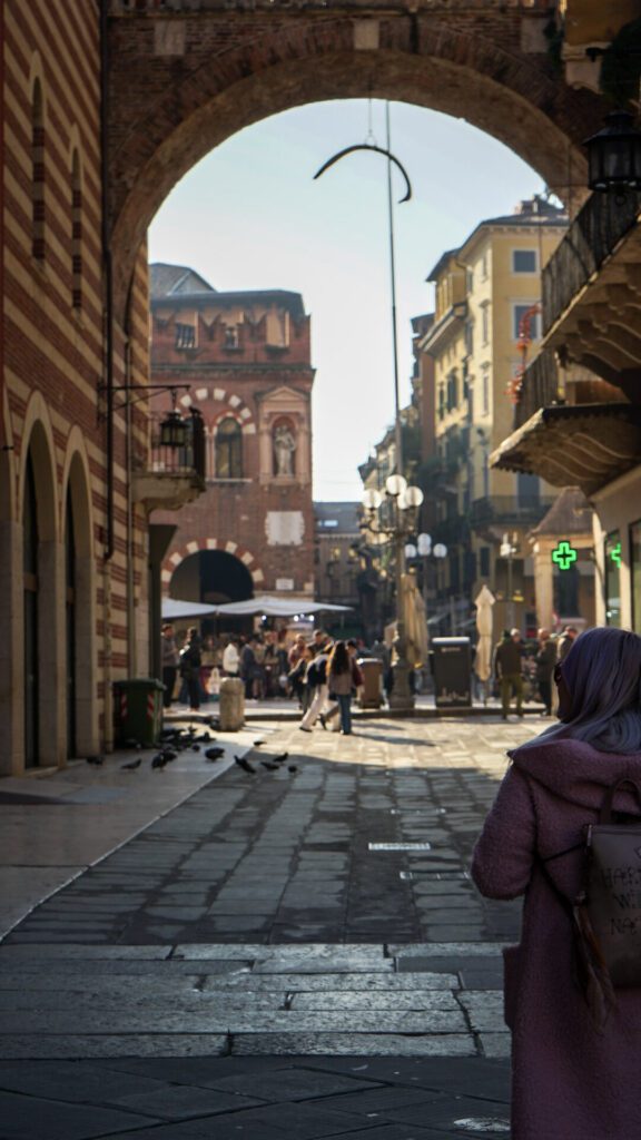 Passages in Verona Italy filled with people near Torre dei Lamberti