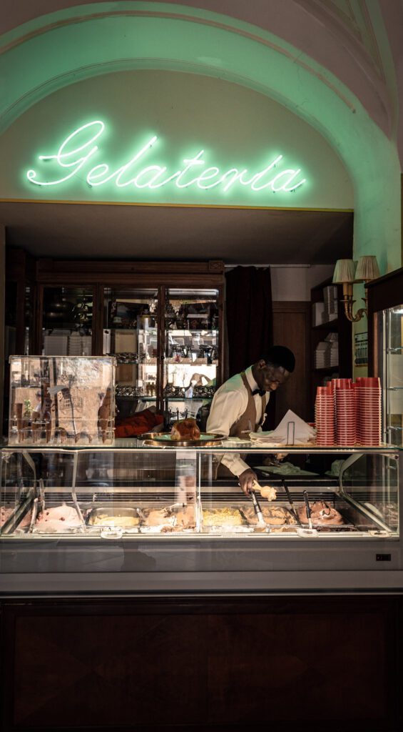 Man making an icecream bowl in a Gelateria in Catania