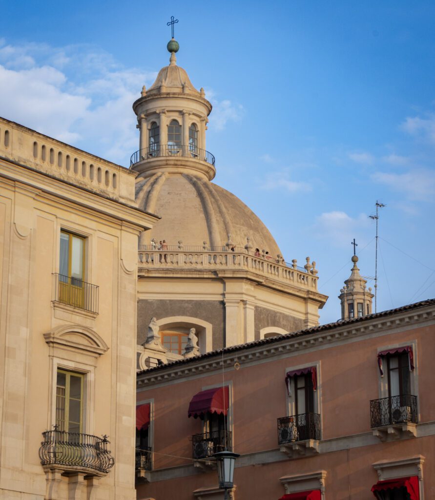 Chiesa della Badia di Sant'Agata dome rises above the blue sky in Catania Sicily