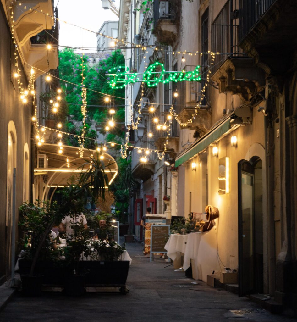 Colorful streets of Catania as night falls