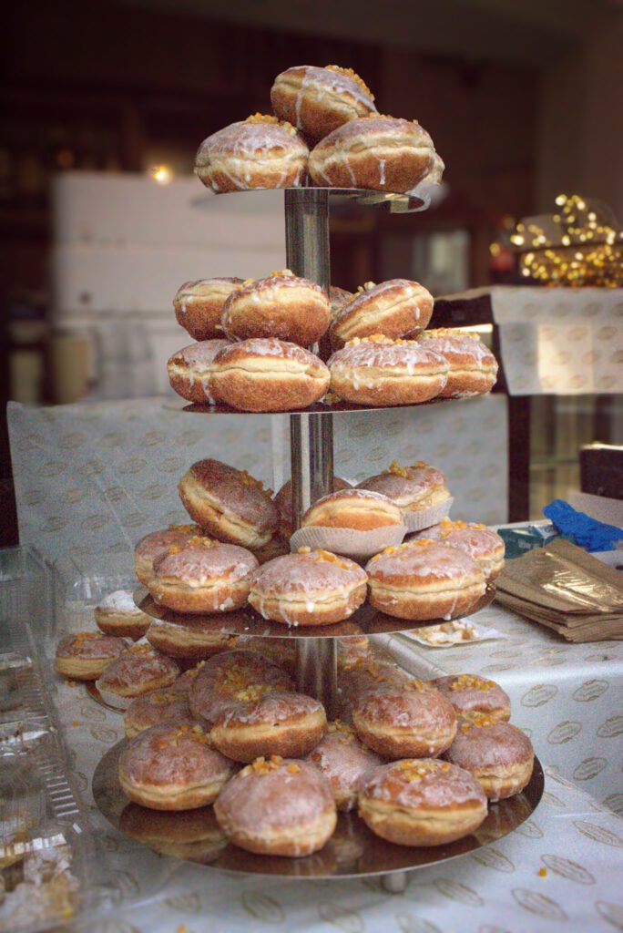 A Cake stand with Donuts filled with glaze