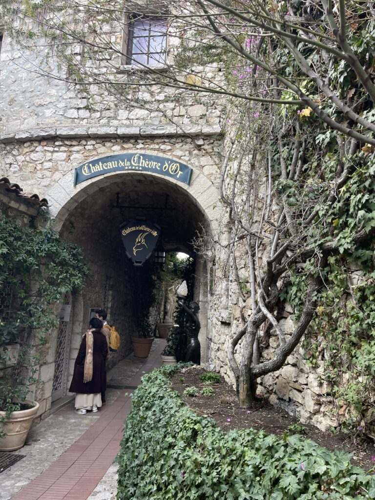 A passage way with traditional houses of Eze