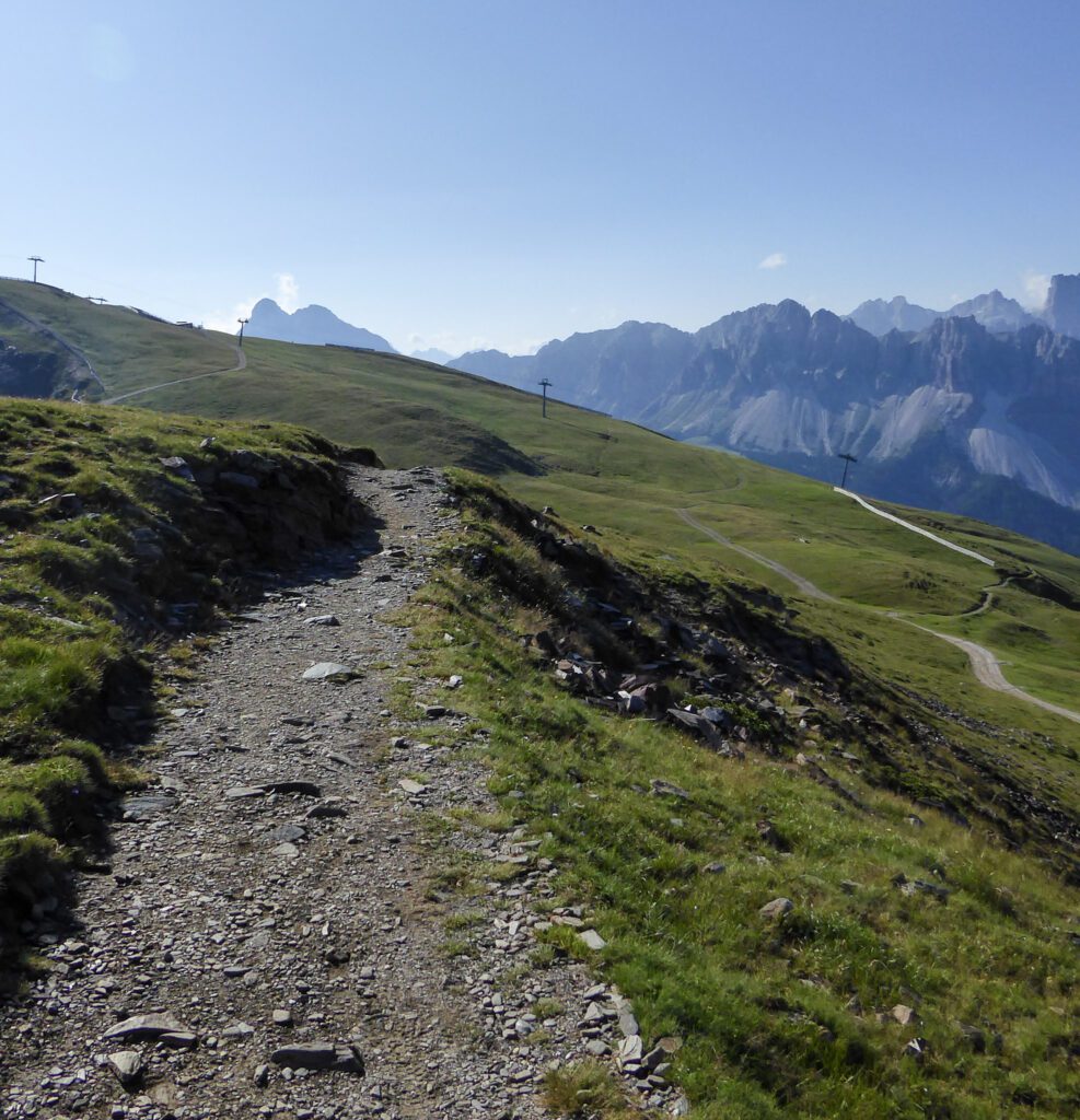 a path on the Alta Via 2 on a sunny day in the Dolomites