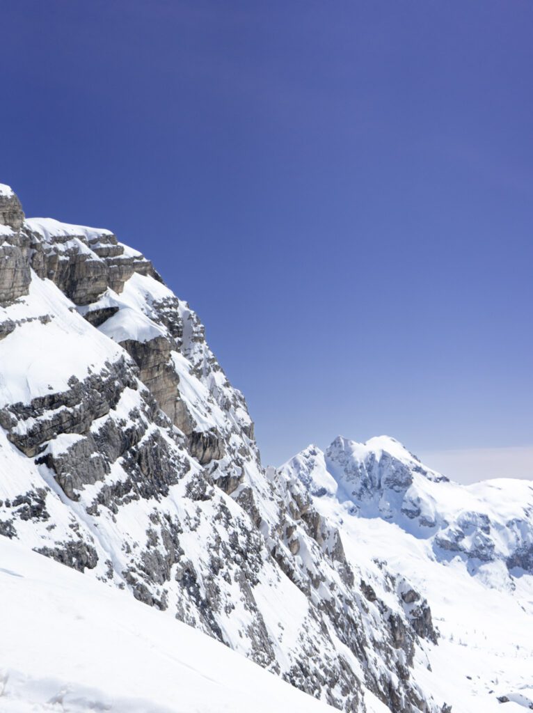 A Snow capped Nuvolau peak against the blue sky