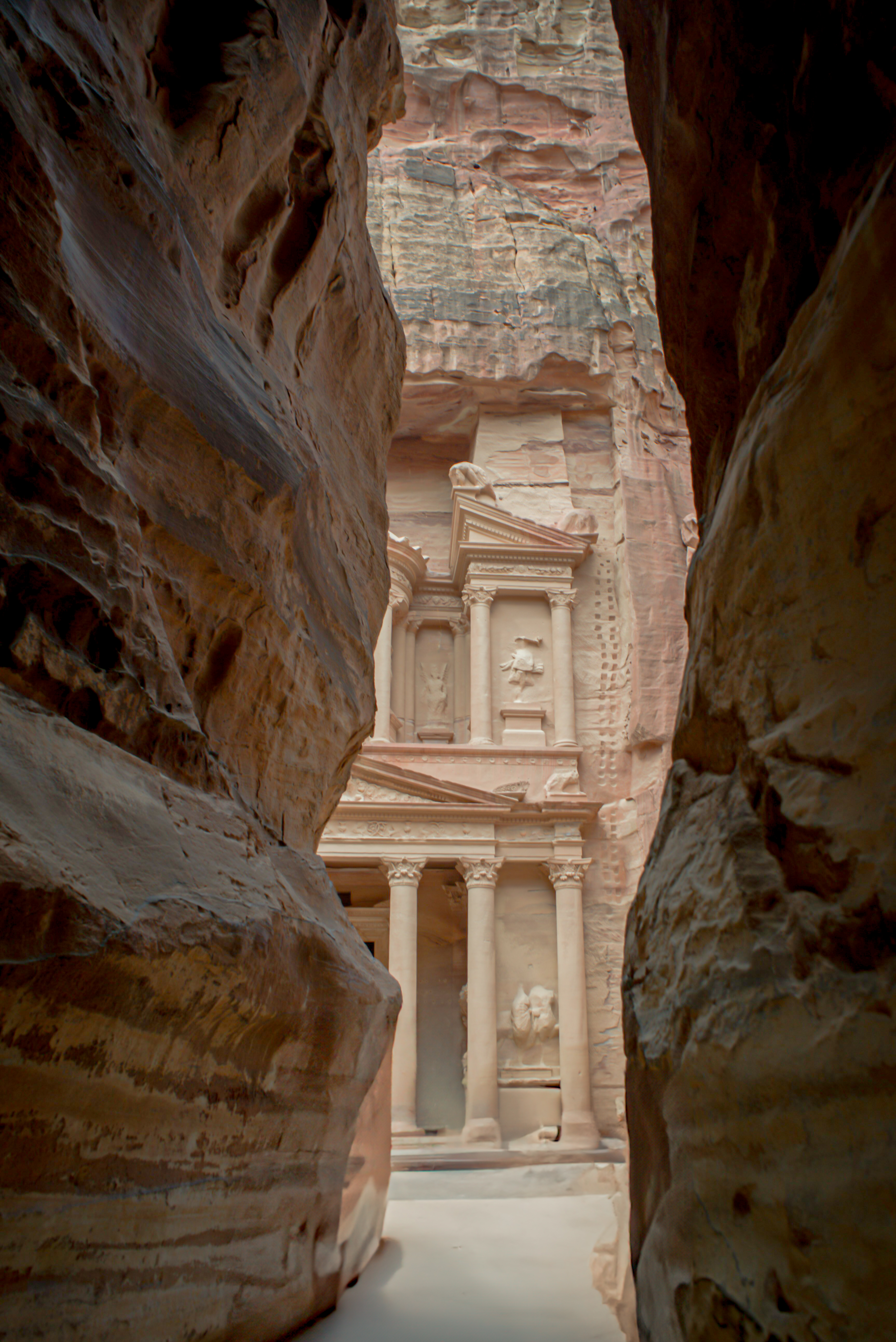 a slit through the the siq in Petra that reveals the treasury in Petra