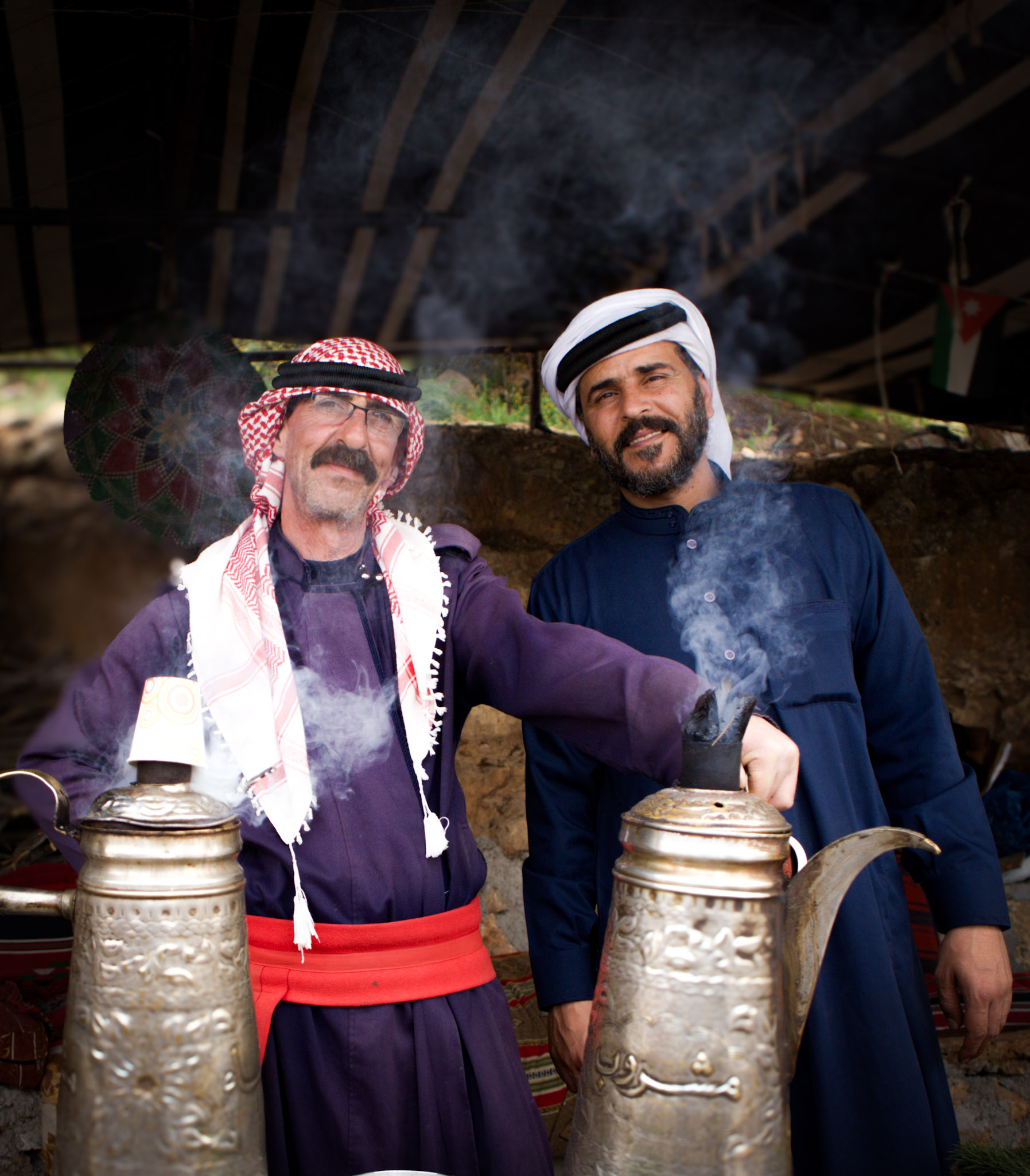 Bedouin men serving cardamom coffee at a tent outside of ajloun castle