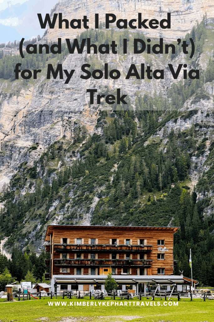 An image of a cozy rifugio set against the mountains with teh text what I packed and what I didn't for my Solo Alta Via Trek