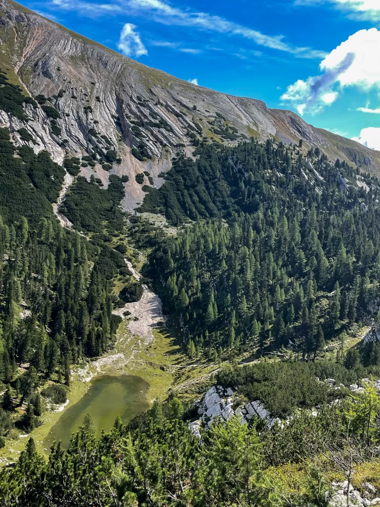 picture of the mountains in the dolomites with a small alpine lake 