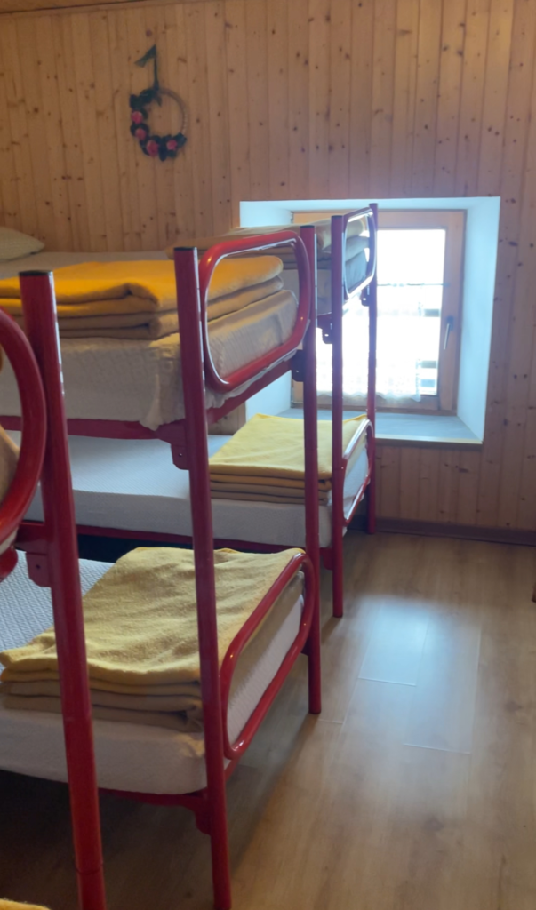 Beds in a rifugio room in Rifugio Calvi