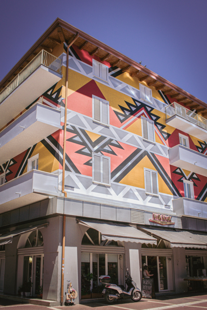 a building with geometric shapes and lines in Piazza Ri in Tirana Albania