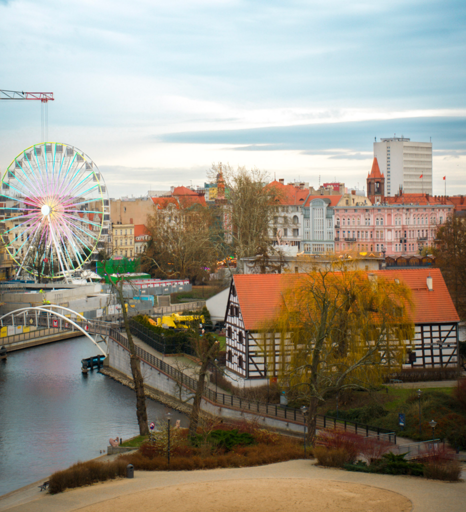 mills and a ferris wheel line the brda river in Bydgoszcz Poland