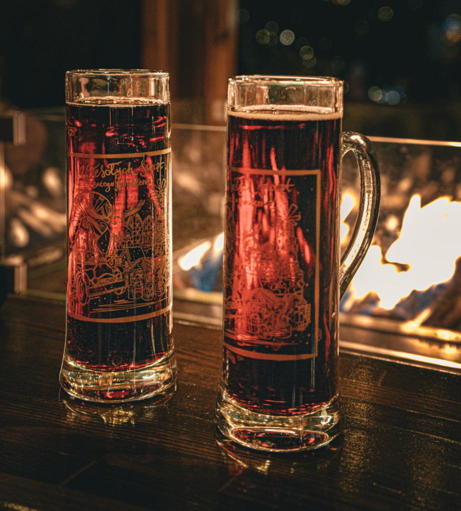 Mulled wine glasses by a fire pit at the Bydgoszcz Christmas Market