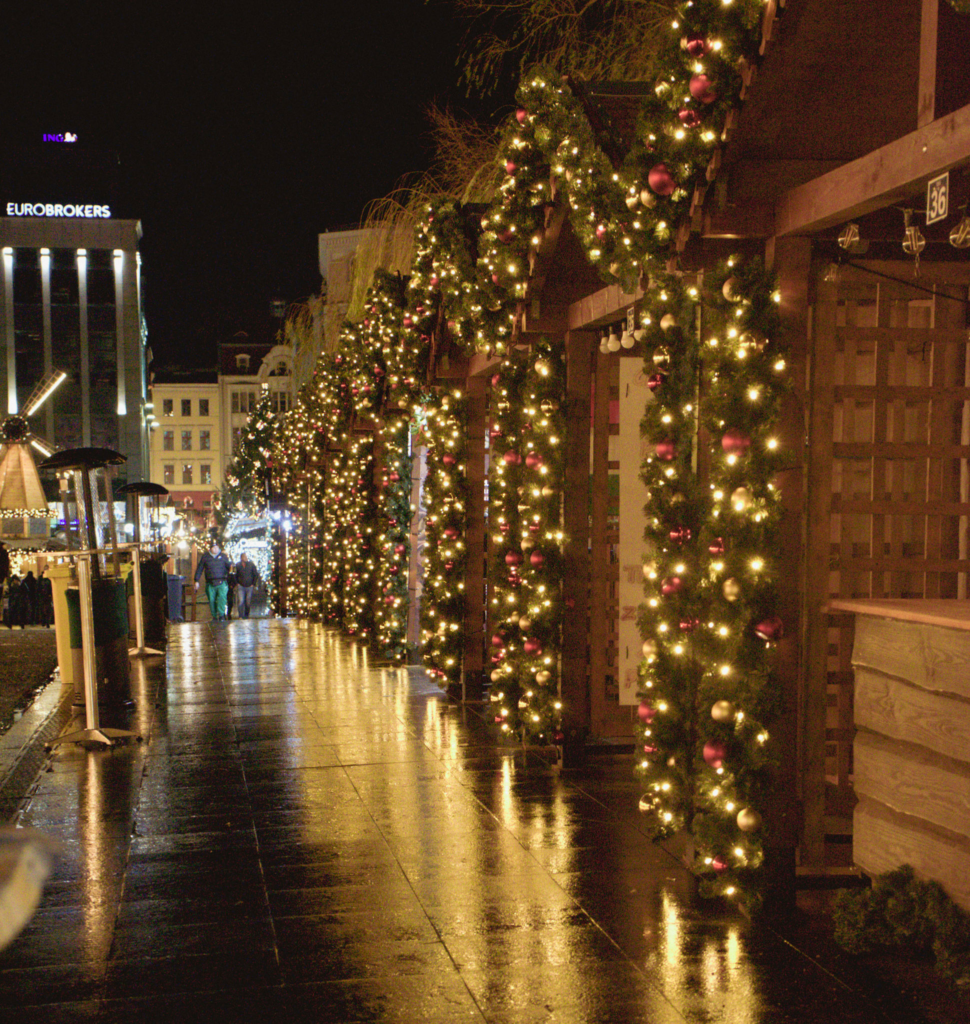 stalls lining mostowa bridge in Bydgoszcz Poland decorated in colorful christmas decor that is lit up