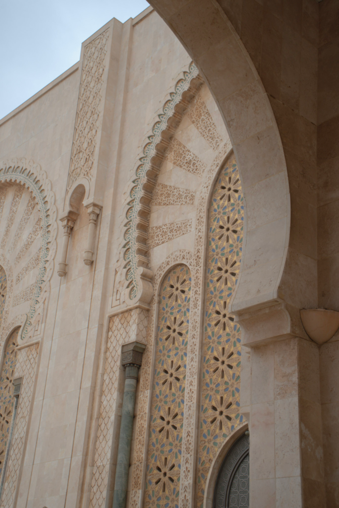 Outdoor details of the Hassan II Mosque with its intricate architecture.