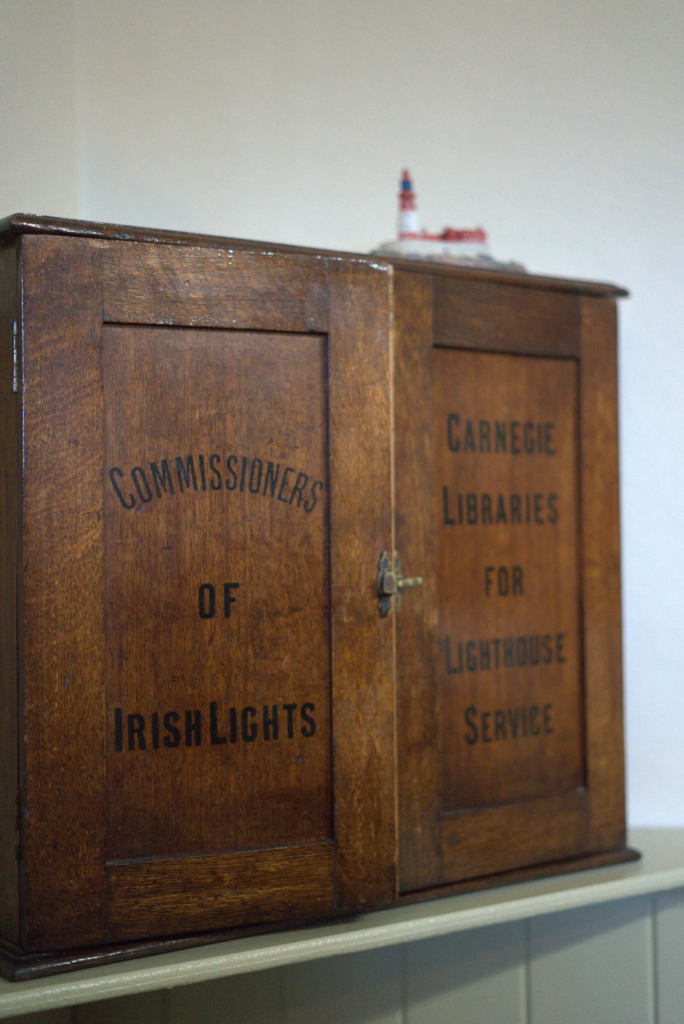 A cabinet that says Lighthouse keepers on it in old style writing