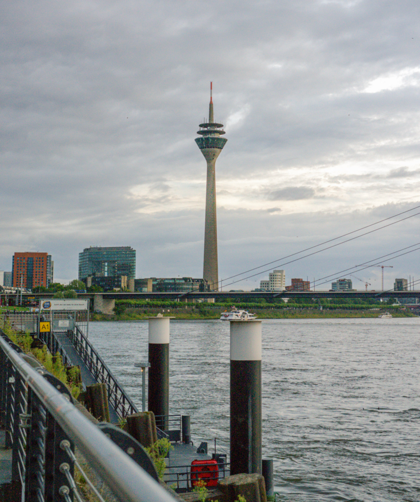 A View of the Rhine river in Dusseldorf with the TV tower in the background on a grey day